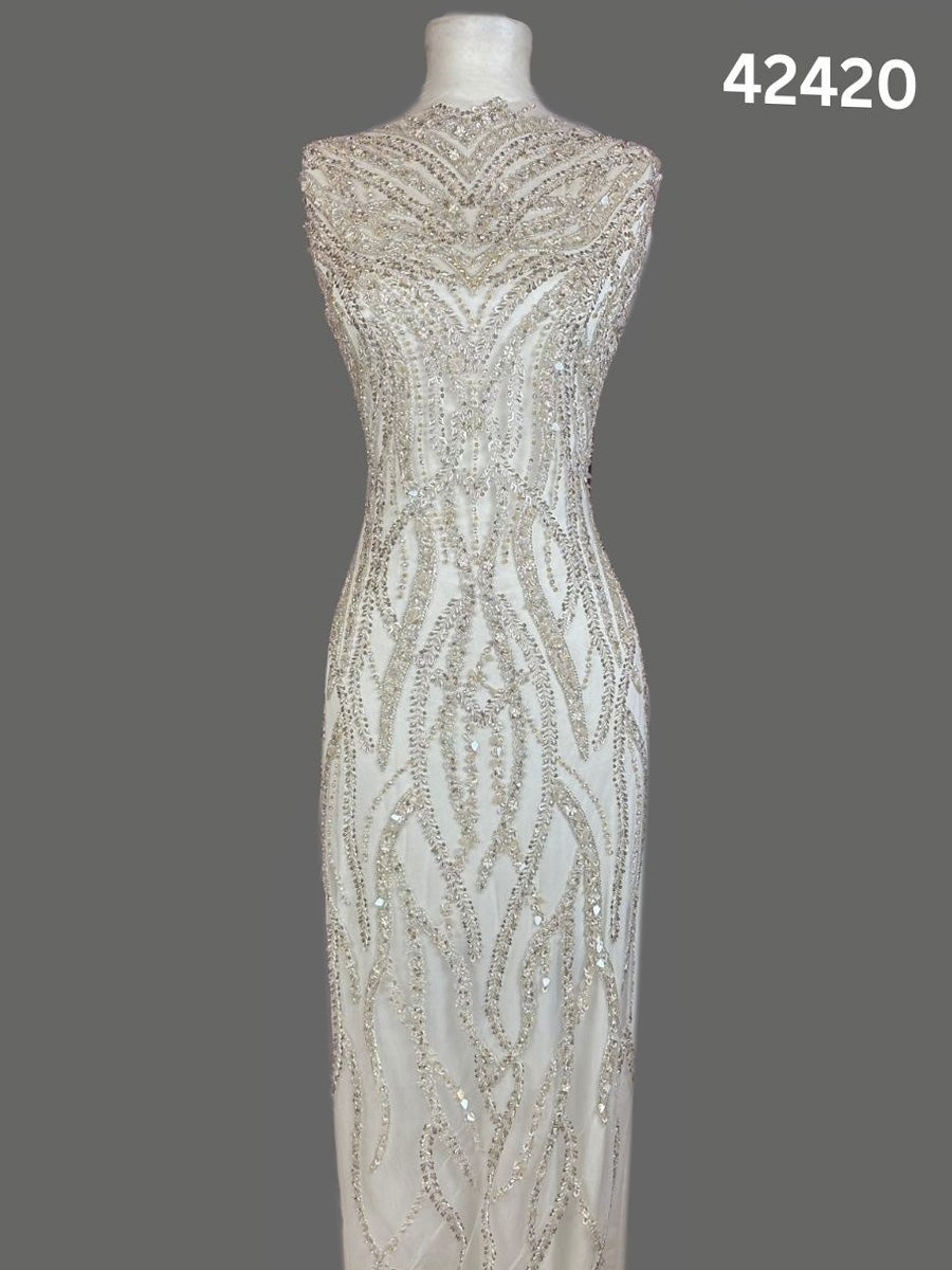 #42420 Elegant Hand-Beaded Silver Bridal Fabric with Asymmetric Design, Embellished with Sequins, Beads, and Rhinestones for a Glamorous Bridal Look