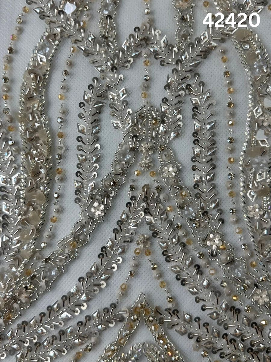 #42420 Elegant Hand-Beaded Silver Bridal Fabric with Asymmetric Design, Embellished with Sequins, Beads, and Rhinestones for a Glamorous Bridal Look