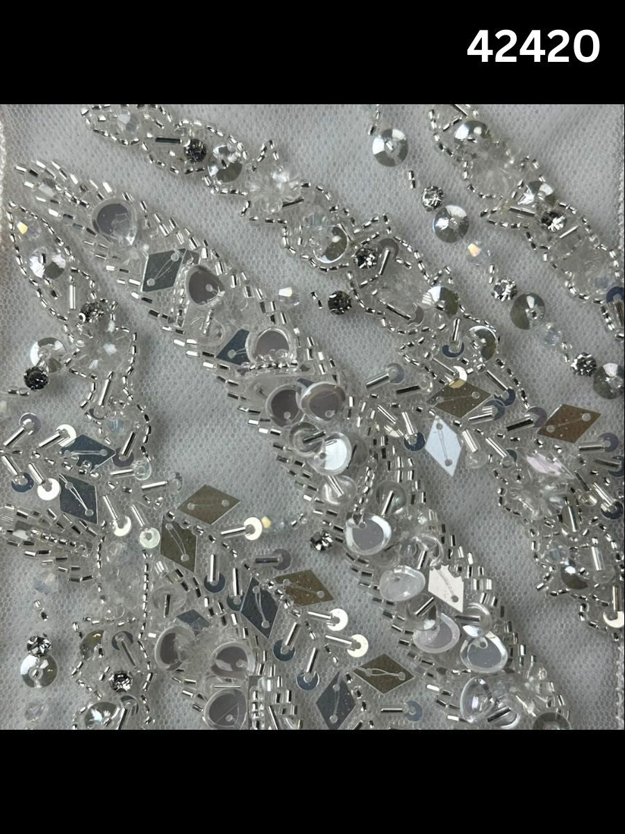 #42420 Elegant Hand-Beaded Silver Bridal Fabric with Asymmetric Design, Embellished with Sequins, Beads, and Rhinestones for a Glamorous Bridal Look