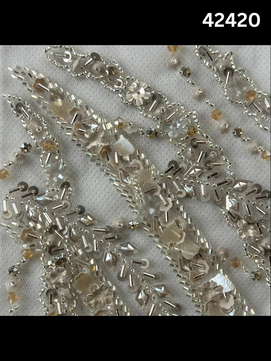 #42420 Elegant Hand-Beaded Silver Bridal Fabric with Asymmetric Design, Embellished with Sequins, Beads, and Rhinestones for a Glamorous Bridal Look